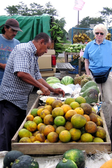 Fruit stand guy cutting guanabana